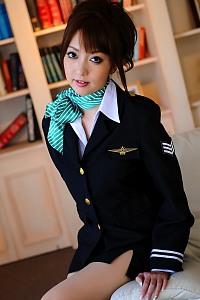 Hot Asian stewardess poses in her uniform